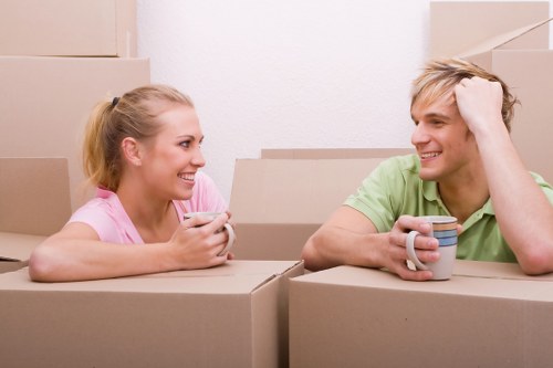 Professional movers handling boxes and furniture